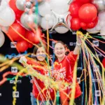two girls with balloons